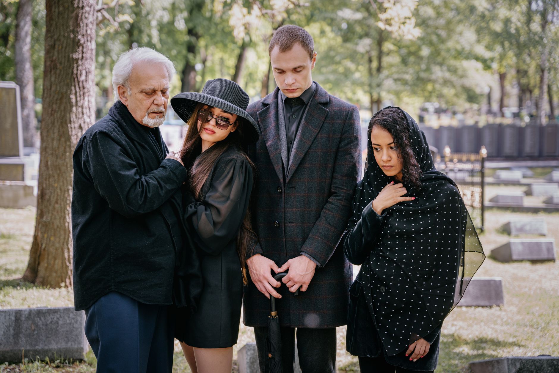 Family members gathered together in quiet reflection